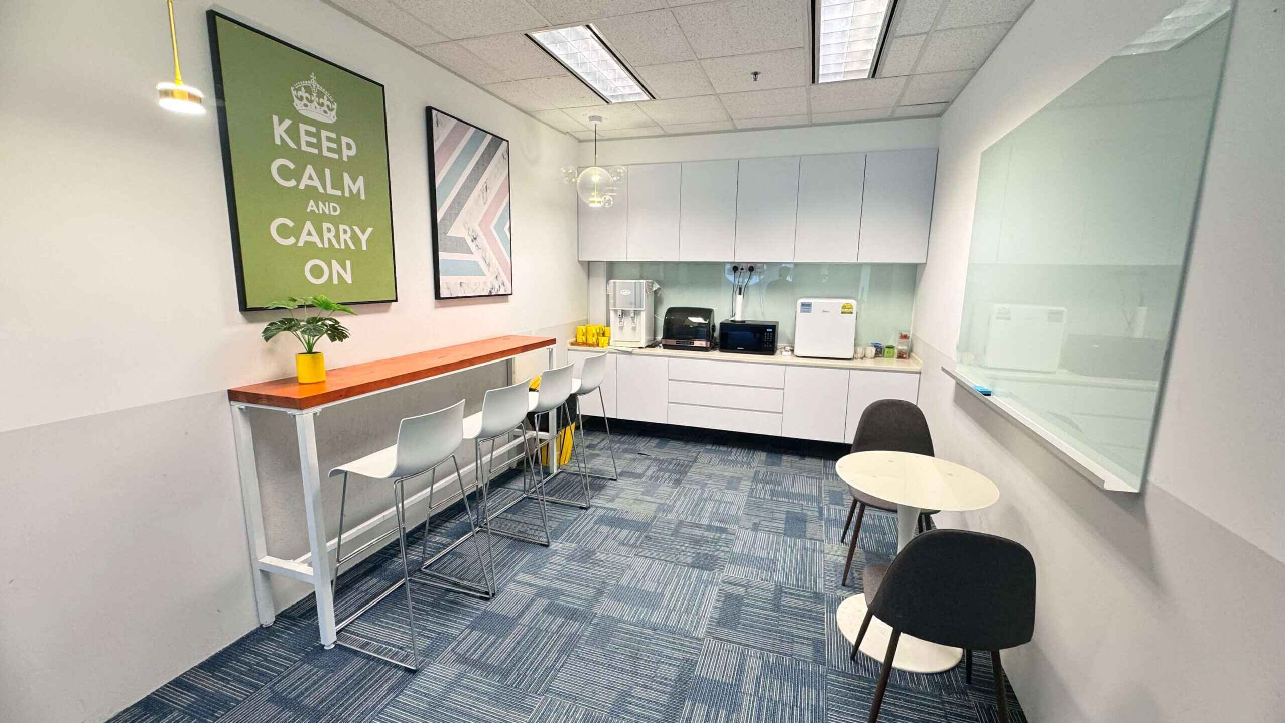 A bright and inviting break room at UClub coworking space.